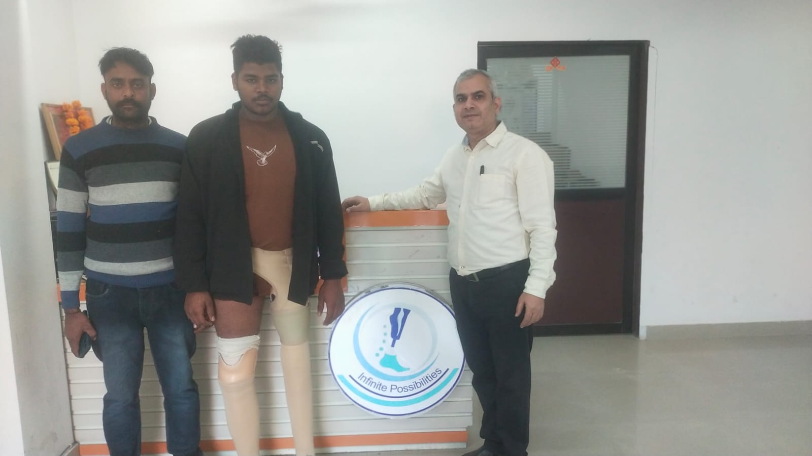 Mr. Hargovind consulting with below-knee prosthetic patient